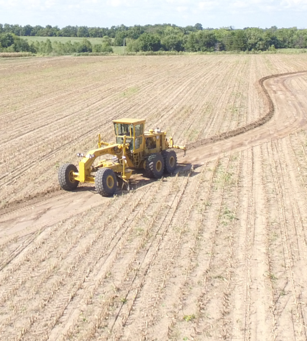 A Grader Building Farm Terraces using Crop Quest Farm Drainage Solutions