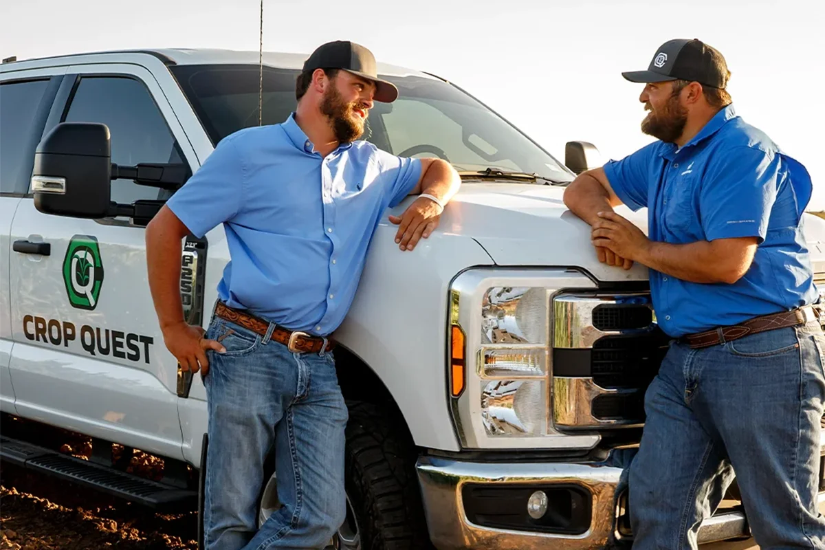 agronomists chatting in front of truck